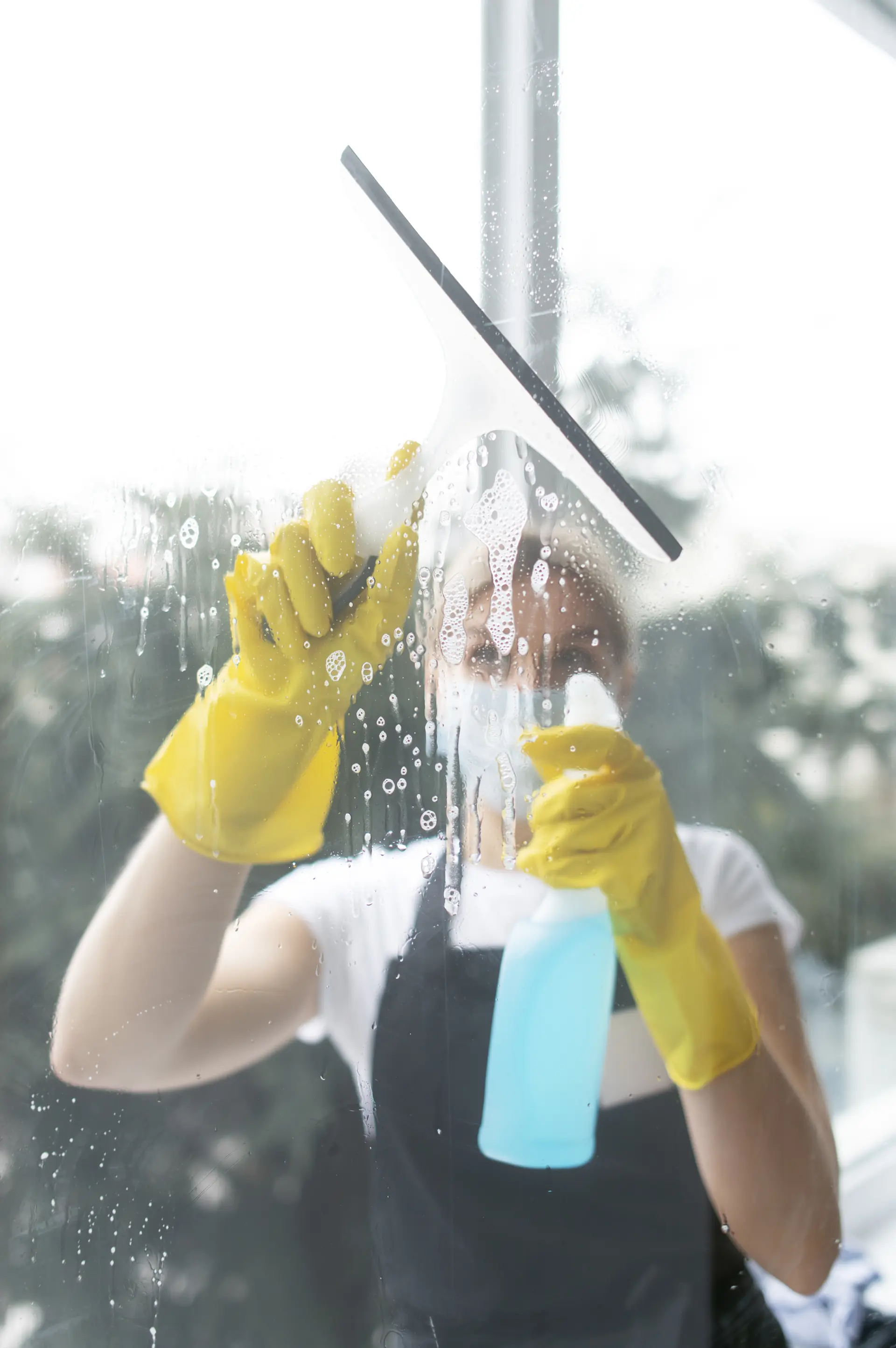 Professional office cleaning service in Qatar - Expert cleaner maintaining workspace